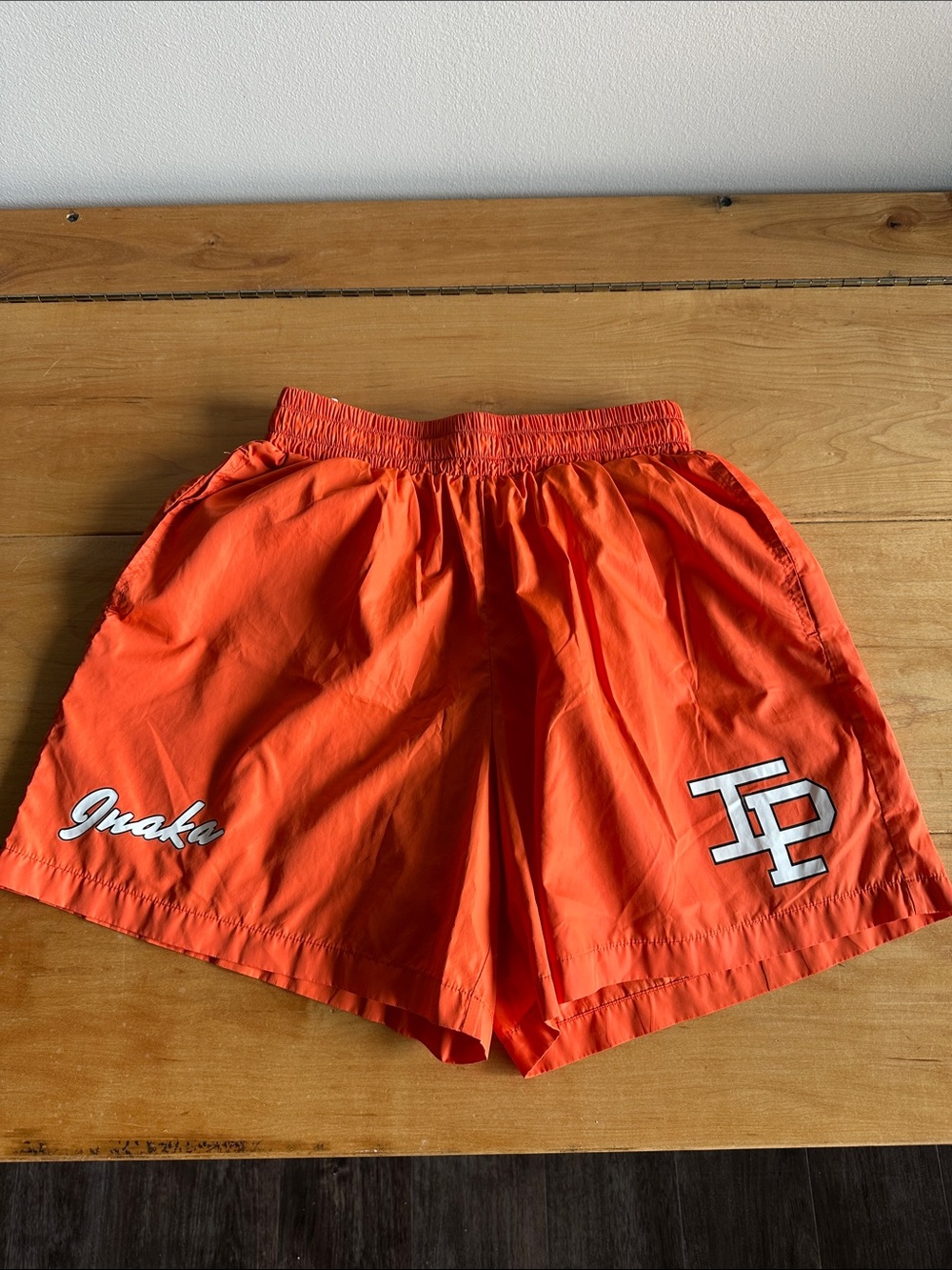 INAKA Power Bright Orange Men’s Swim Shorts with Script Logo